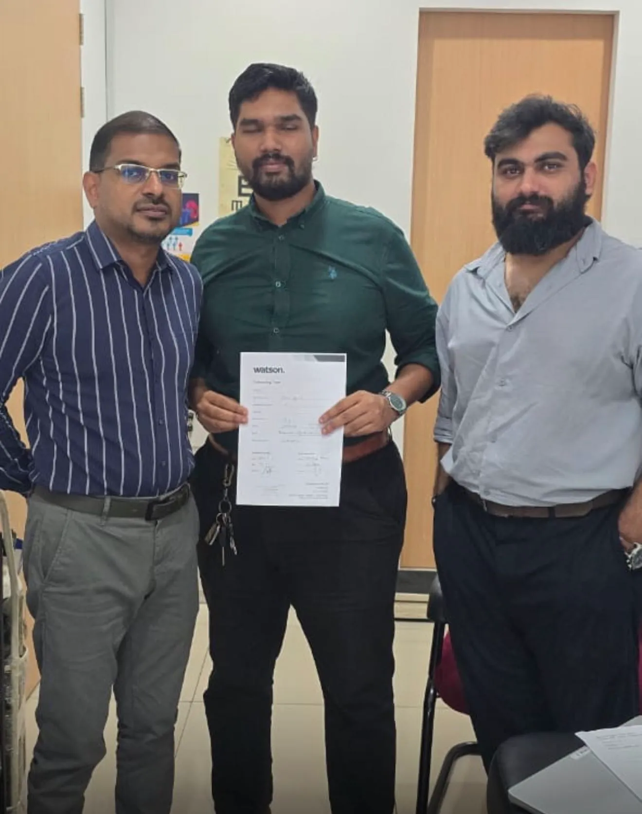 Dr. Jegathisan Kalidas with the Watson team at Klinik Segara Solaris Dutamas, holding the signed agreement.
